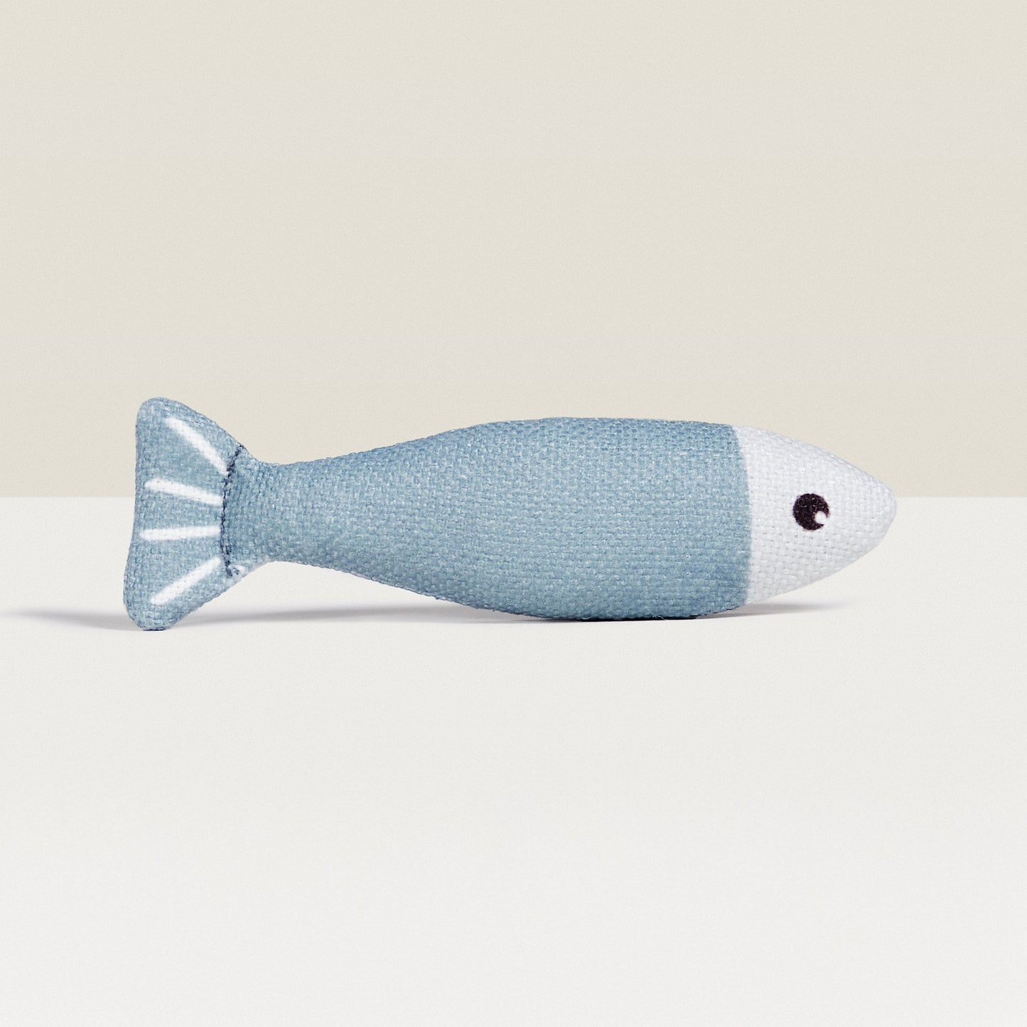 A White And Blue Cat Toy Shaped Like A Fish